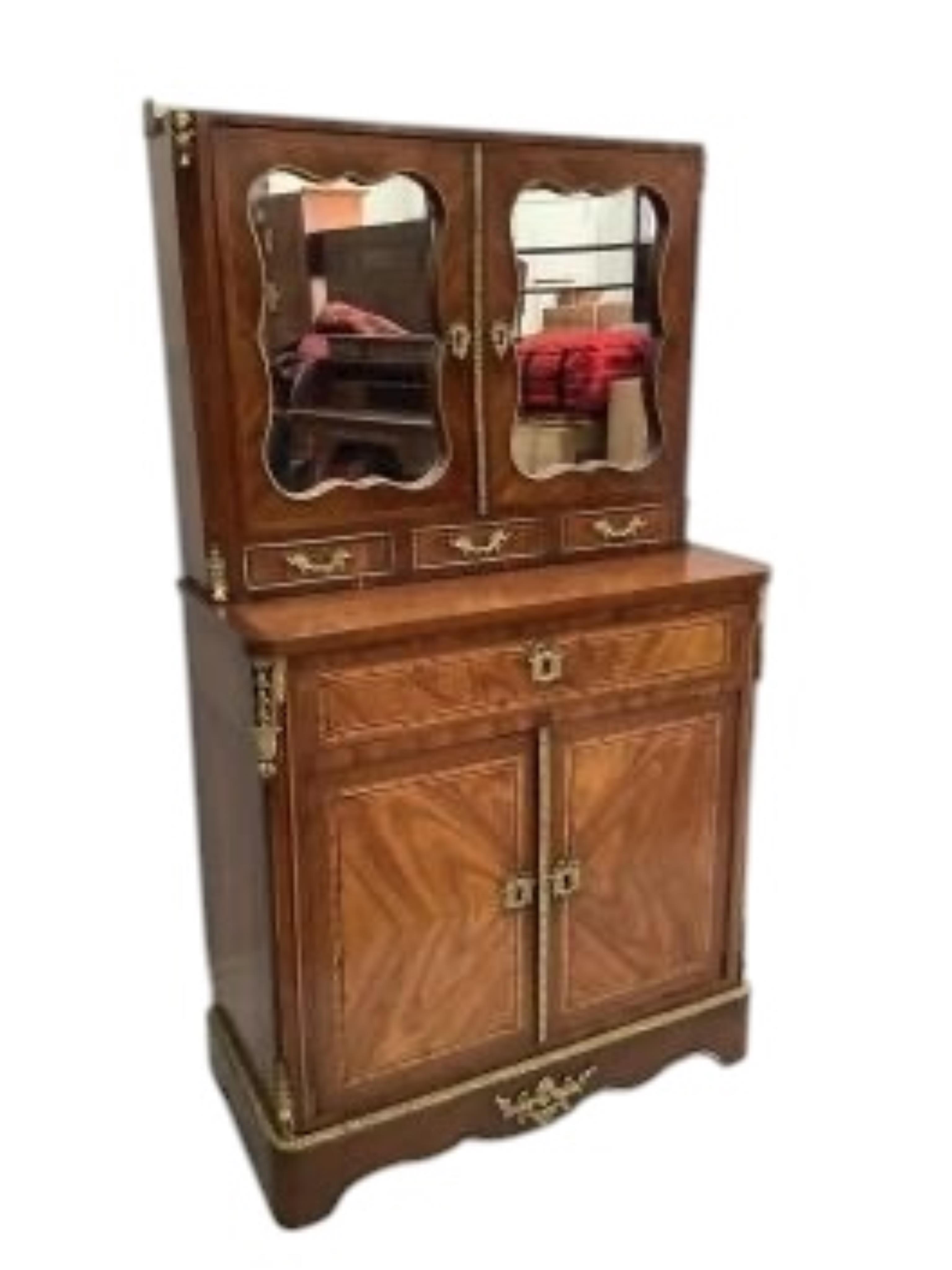 A Louis XVI style gilt metal mounted walnut and mahogany side cabinet, width 80cm, depth 37cm, height 142cm